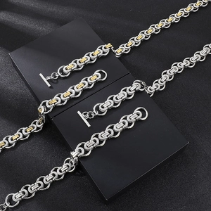 Macro detail of Byzantine chain necklace with OT clasp in silver and gold tone