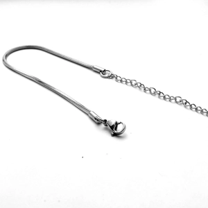 Detail view of titanium steel snake chain with adjustable lobster clasp and extension links