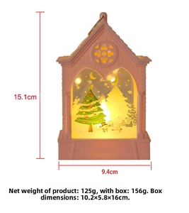 Pink church-shaped Christmas lantern with snowman scene and dimensions at 15.1x9.4cm