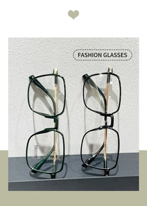 Detail of square glasses frame with gold metal temples and blue light blocking lenses
