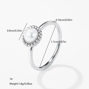 Minimalist silver stainless steel ring featuring a single white pearl and sizing details