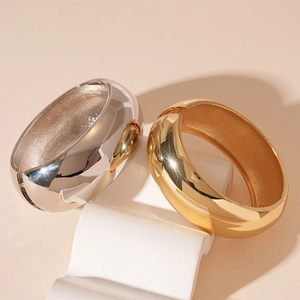 Polished wide geometric open cuff bracelet in gold and silver finish for women