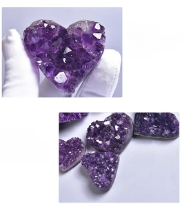 Macro shot of natural Uruguayan purple amethyst heart cluster with raw crystal texture