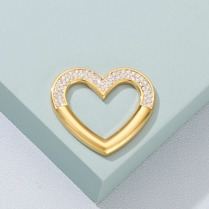 Minimalist gold heart necklace pendant with sparkling white rhinestones on geometric stand