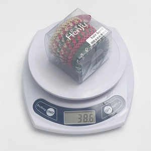 Detailed view of an 8-piece Christmas hair tie set in gift box showing 38.6g weight