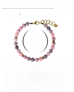 Detail of 6mm pink zebra stone beads with adjustable stainless steel gold clasp