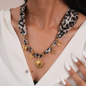 Retro stainless steel leopard print fabric necklace with gold sun and butterfly charms