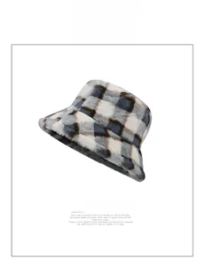 Close-up of the thick plaid plush bucket hat with fluffy faux fur texture and warm fabric