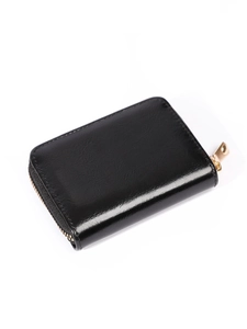 Close-up of compact black leather accordion wallet with gold zipper on white background