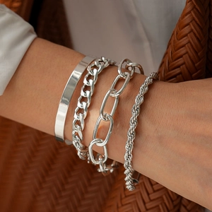 Minimalist silver geometric twist bracelet set for women with four distinct metal designs