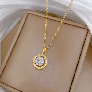 Detailed view of a gold-plated necklace featuring a round zircon halo pendant on silk