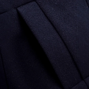 Deep blue wool blend jacket featuring detailed side pocket stitching and premium fabric texture