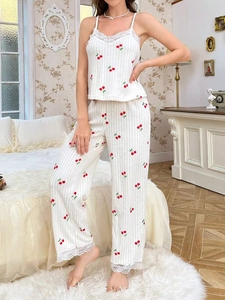 Detail of cherry print sleepwear set with ribbed texture and white lace trim