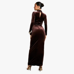 Detail view of brown long sleeve dress featuring an elegant back cutout and velvet texture