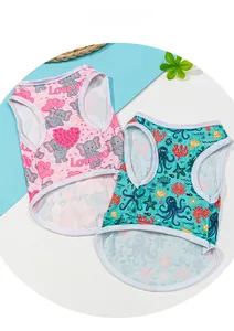 Close-up of lightweight dog vests with cartoon elephant and marine life prints