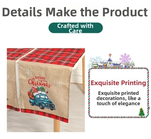Close-up of rustic Christmas table runner with blue truck print and red plaid edge