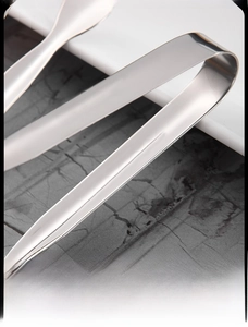 Macro view of polished 304 stainless steel ice clip with smooth rounded edges