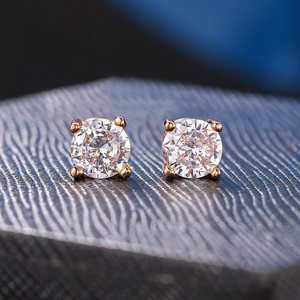 Classic 4-prong round cubic zirconia stud earrings in rose gold finish for women