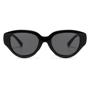 Fashionable oversized black cat-eye sunglasses with dark grey lenses on white background