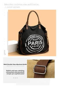 Detail of silver metal buckle and adjustable strap on large canvas tote bag