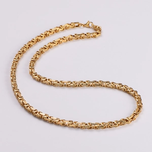 Detailed close-up of a luxury gold-plated stainless steel Byzantine chain necklace