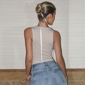 Rear view of beige slim-fit square neck tank top showing fabric texture and tight fit