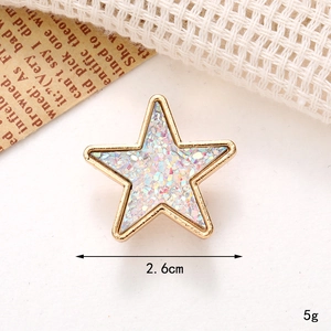 Detailed close-up of a 2.6cm gold star charm with glitter inlay and size indicators