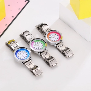 Detailed view of three children's quartz watches with metal straps in blue and green