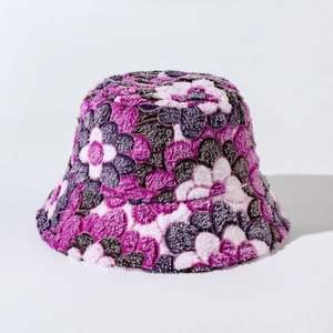 Macro view of plush purple and white floral bucket hat showing soft winter warm texture