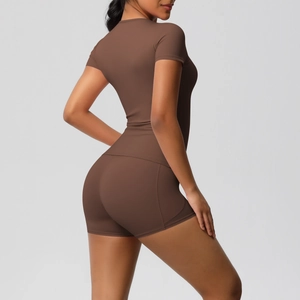 Detail of high-waist yoga shorts with contouring seams in coffee brown brushed fabric