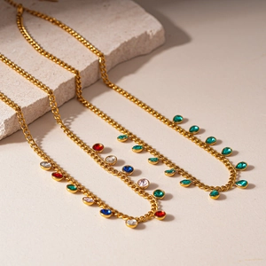 Golden stainless steel sweater necklace with round and teardrop-shaped colorful gemstones