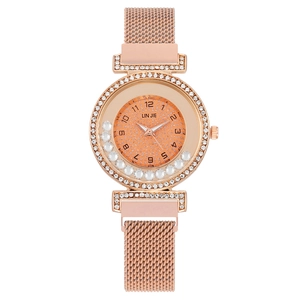 Elegant rose gold Milanese mesh strap watch with sparkling moving crystals and rhinestones