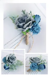 Detail of dusty blue artificial rose boutonniere with silk petals and jute rope wrap