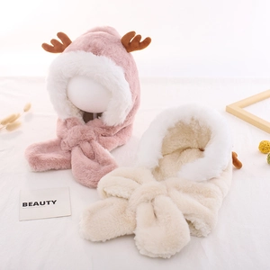 Plush winter earflap hat for kids featuring cute antlers in pink and beige colors