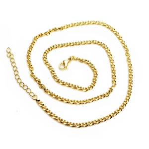 Detail of gold Cuban link chain necklace with lobster clasp and adjustable extender