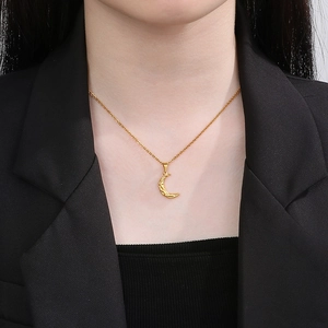 Polished 18K gold-plated crescent moon pendant necklace with detailed relief texture