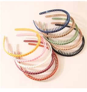 Detailed close-up of matte nonslip headbands with fine teeth in ten vibrant colors
