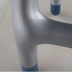 Detailed close-up of inflatable walker leg with silver finish and blue anti-slip foot tip