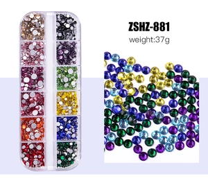 Detailed view of ZSHZ-881 12-grid organizer box with colorful mixed nail art rhinestones