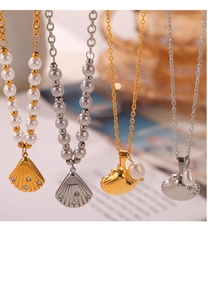 Detail of shell pendants with pearls and rhinestones on gold and silver titanium chains