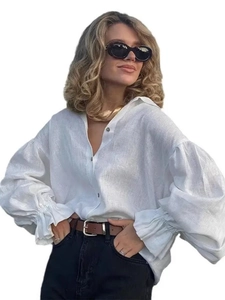 Women's white linen long sleeve shirt with lantern sleeves and ruffle cuff details