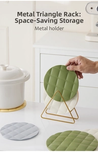 Golden metal triangle rack holding multi-colored silicone placemats with diamond texture