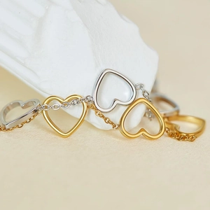Adjustable stainless steel heart chain bracelet with gold and silver hollow heart charms