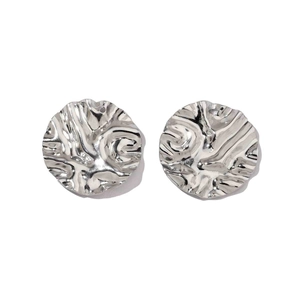 Close-up of silver stainless steel earrings with irregular wavy texture on white background