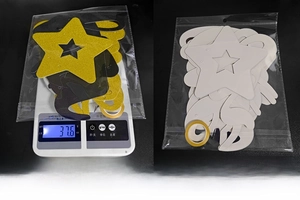 Detail of glitter Happy New Year banner in packaging showing weight and dimensions