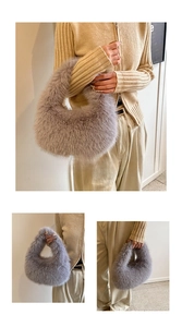 Detailed view of grey plush crescent faux fur handbag with a soft integrated handle