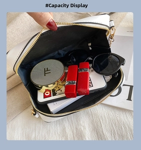Top view of white crossbody bag interior showing spacious storage for makeup and phone