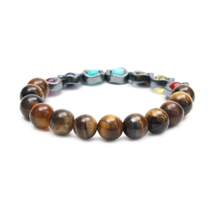 Macro detail of wave tiger eye stones and colorful yoga beads on men's beaded bracelet