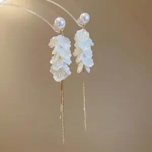 Elegant white petal drop earrings with long gold tassels and pearl studs for women