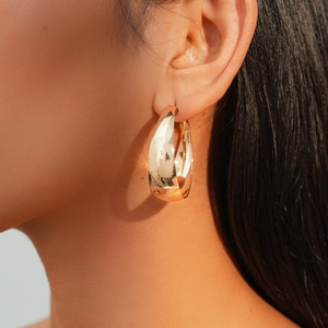 Modern minimalist chunky golden hoop earring with a polished mirror finish for women